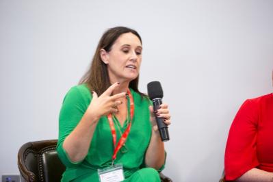 Lady talking with microphone in hand